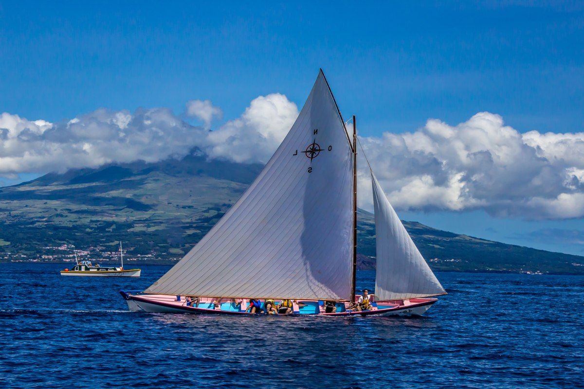 An Azorean whaleboat under sail, featured by New Bedford’s Azorean Maritime Heritage Society; maritime heritage context, not identified as a Massachusetts location.