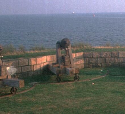 Historic cannon overlooking the shore at Fort Phoenix State Reservation.
