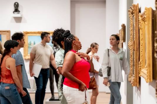Visitors looking at paintings in the Harvard Art Museums’ galleries.