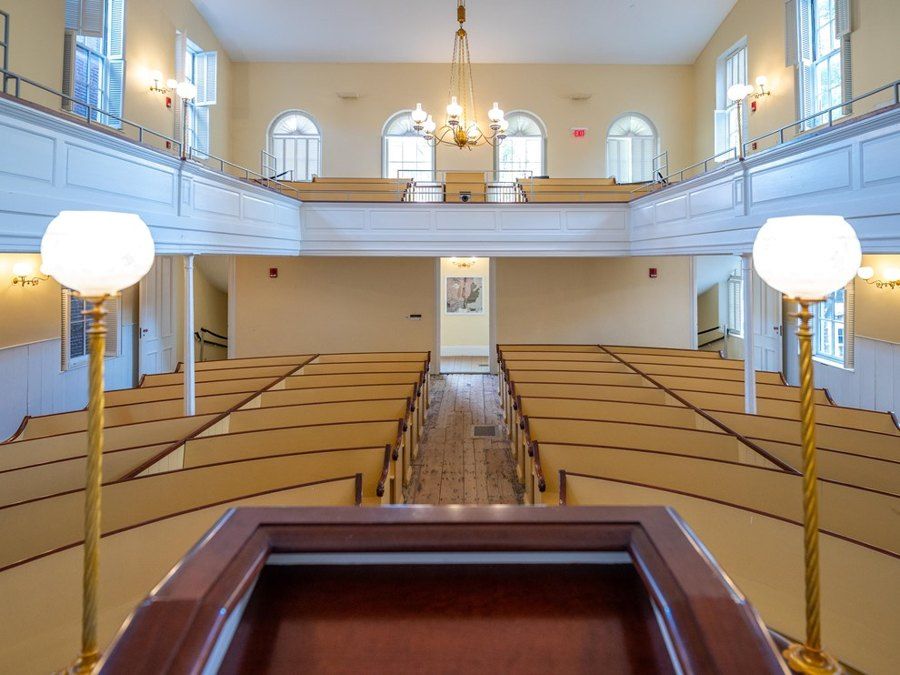 View from the pulpit at the African Meeting House, which has rows of benches and an upper gallery